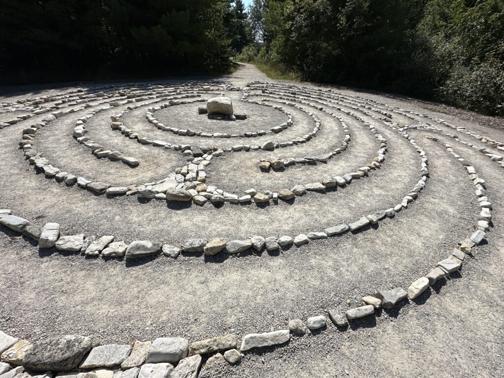 a labyrinth of stones form a meditation path that winds around a centerpoint
